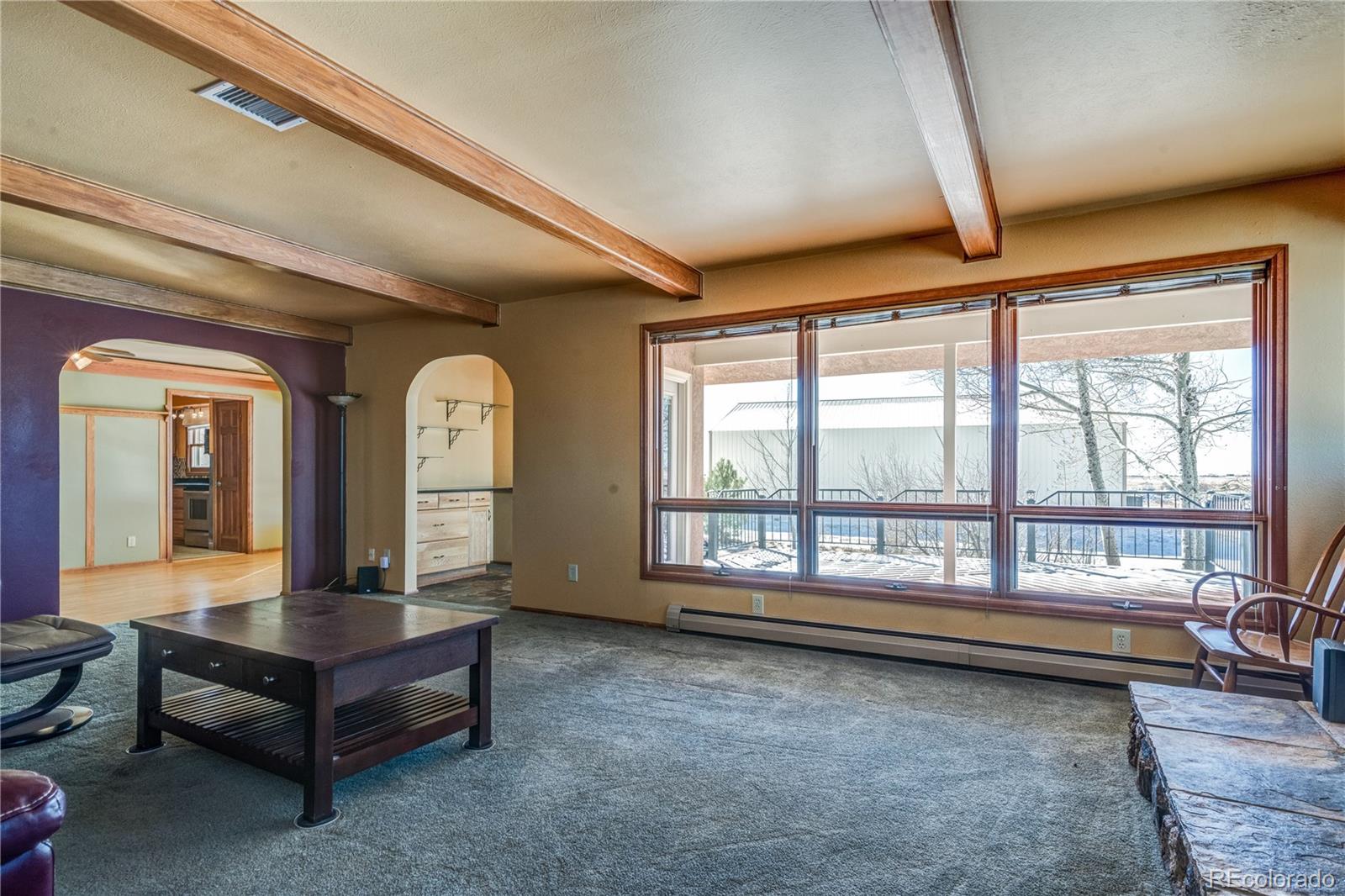 16065 Jones Road Peyton, CO 80831 - Photo 14 of 29 a living room with furniture and a large window
