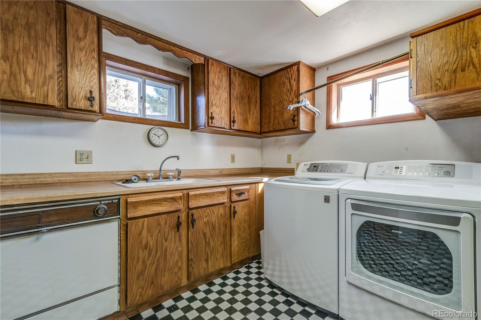 16065 Jones Road Peyton, CO 80831 - Photo 22 of 29 a utility room with sink dryer and washer