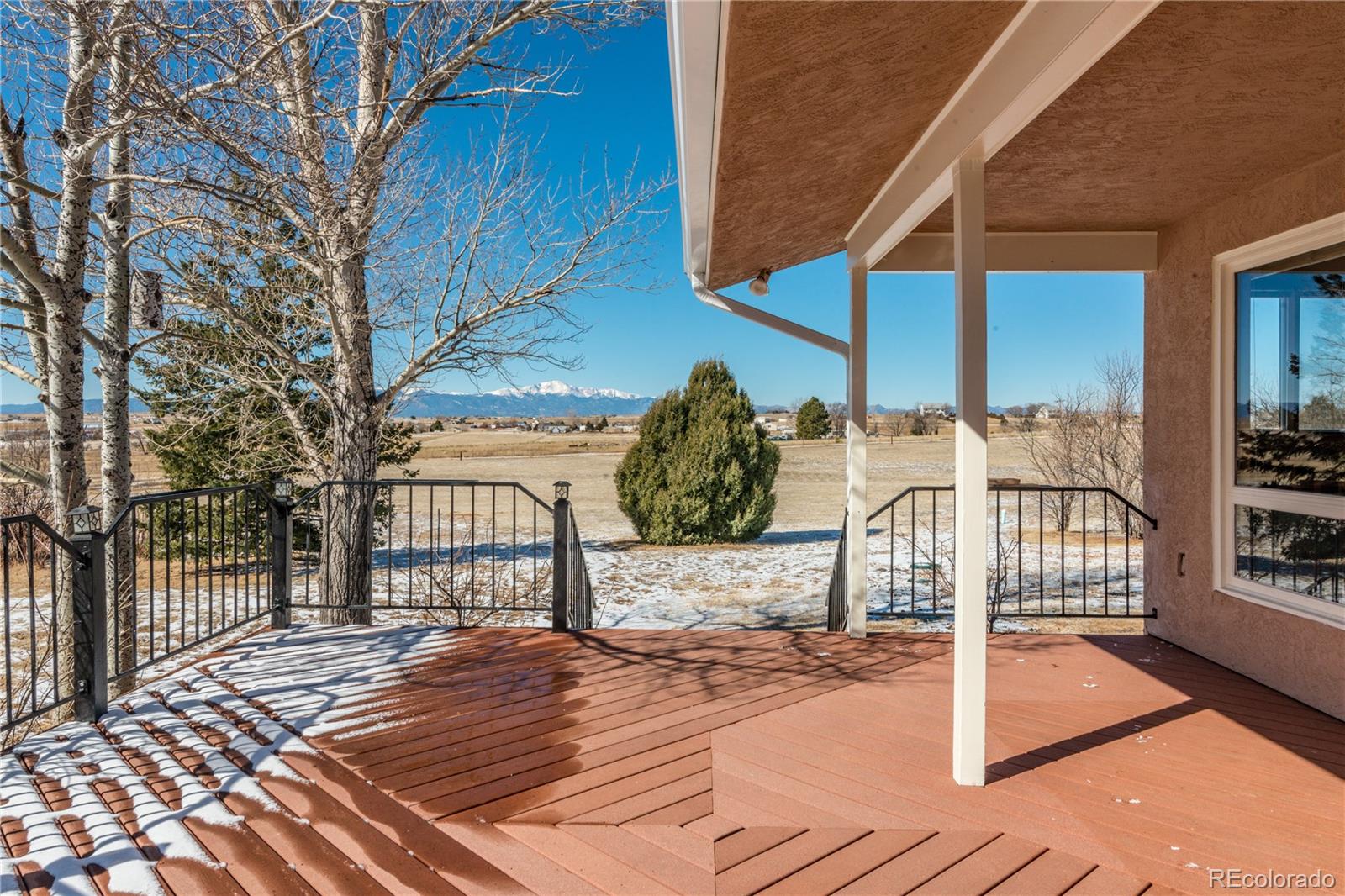 16065 Jones Road Peyton, CO 80831 - Photo 24 of 29 a view of a terrace with wooden floor