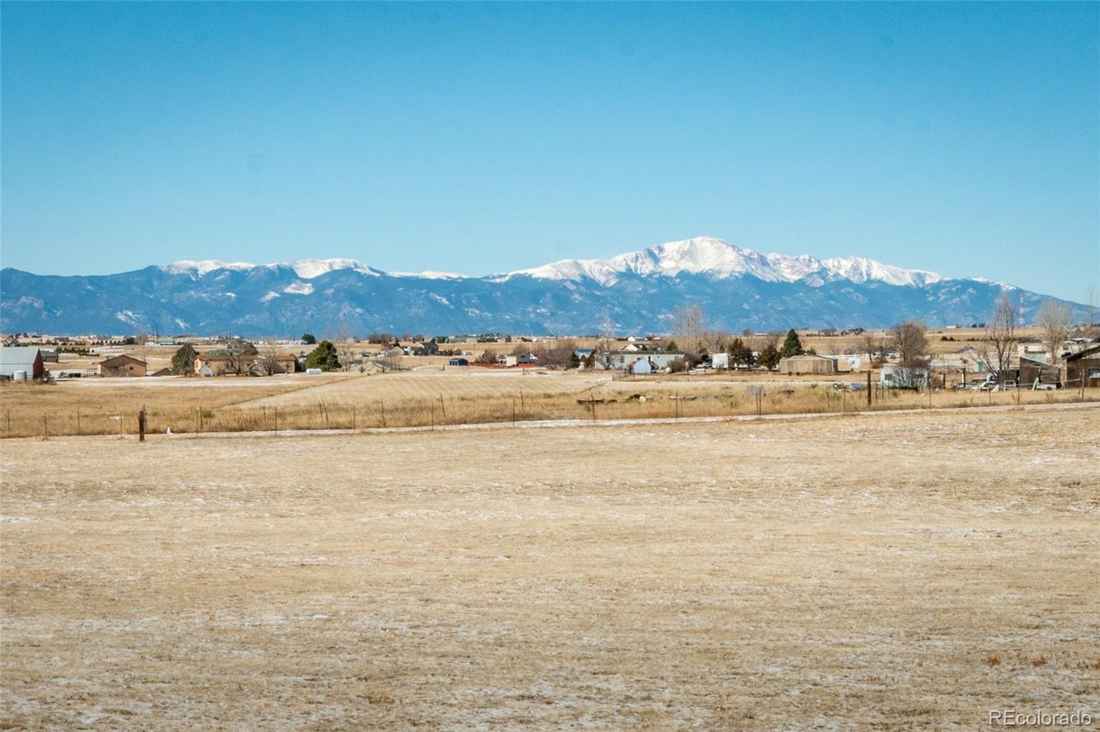 16065 Jones Road Peyton, CO 80831 - Photo 28 of 29 a view of an ocean with a mountain