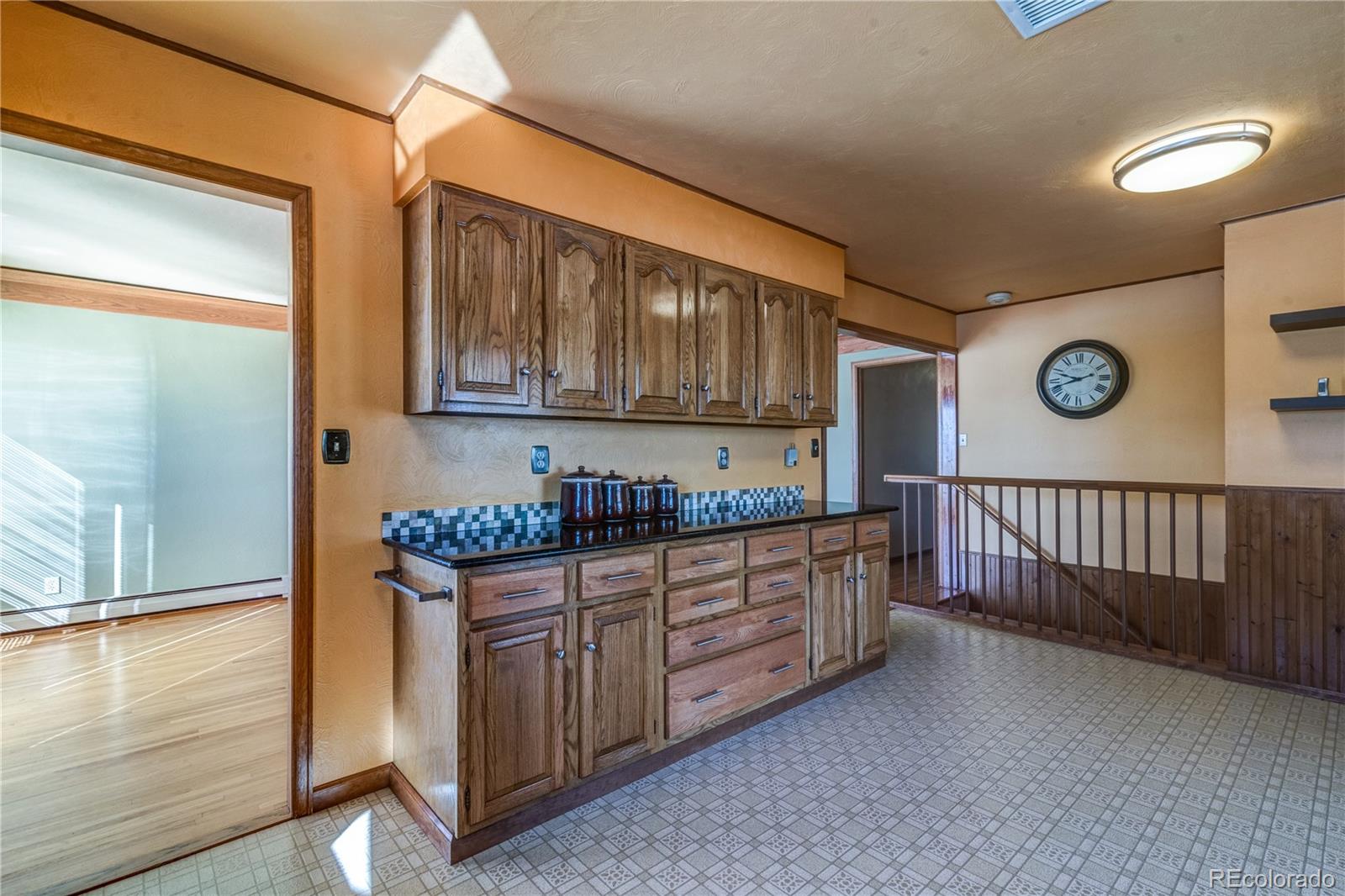 16065 Jones Road Peyton, CO 80831 - Photo 5 of 29 a kitchen with stainless steel appliances granite countertop a stove and cabinets