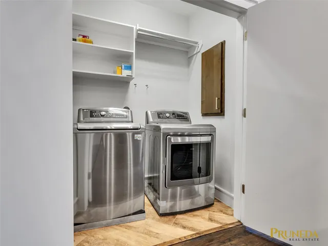 a utility room with washer and dryer