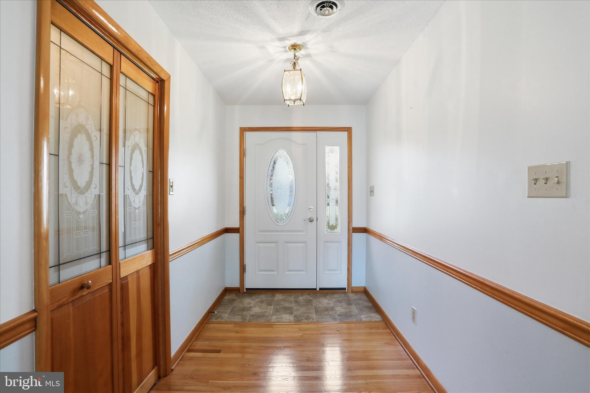 20 Minnick Road Inwood, WV 25428 - Photo 22 of 50 Foyer entry with chair rail & closet