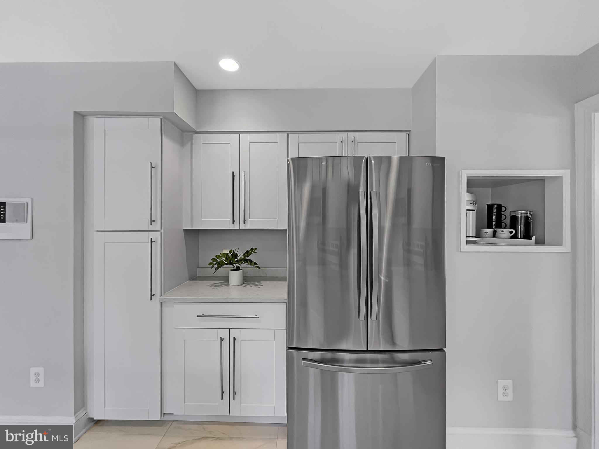 2045 Hunter Mill Road Vienna, VA 22181 - Photo 12 of 35 Wall of Cabinets with coffee bar