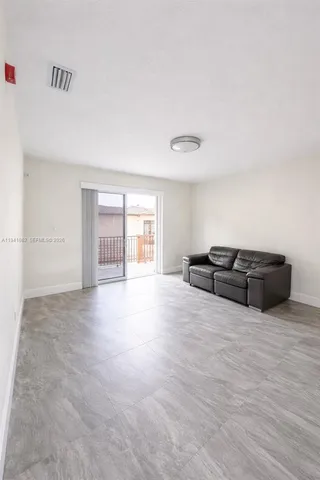 a living room with furniture and window