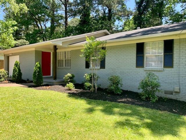 2267 Chestnut Hill Circle Decatur, GA 30032 - Photo 1 of 1 a backyard of a house with seating space