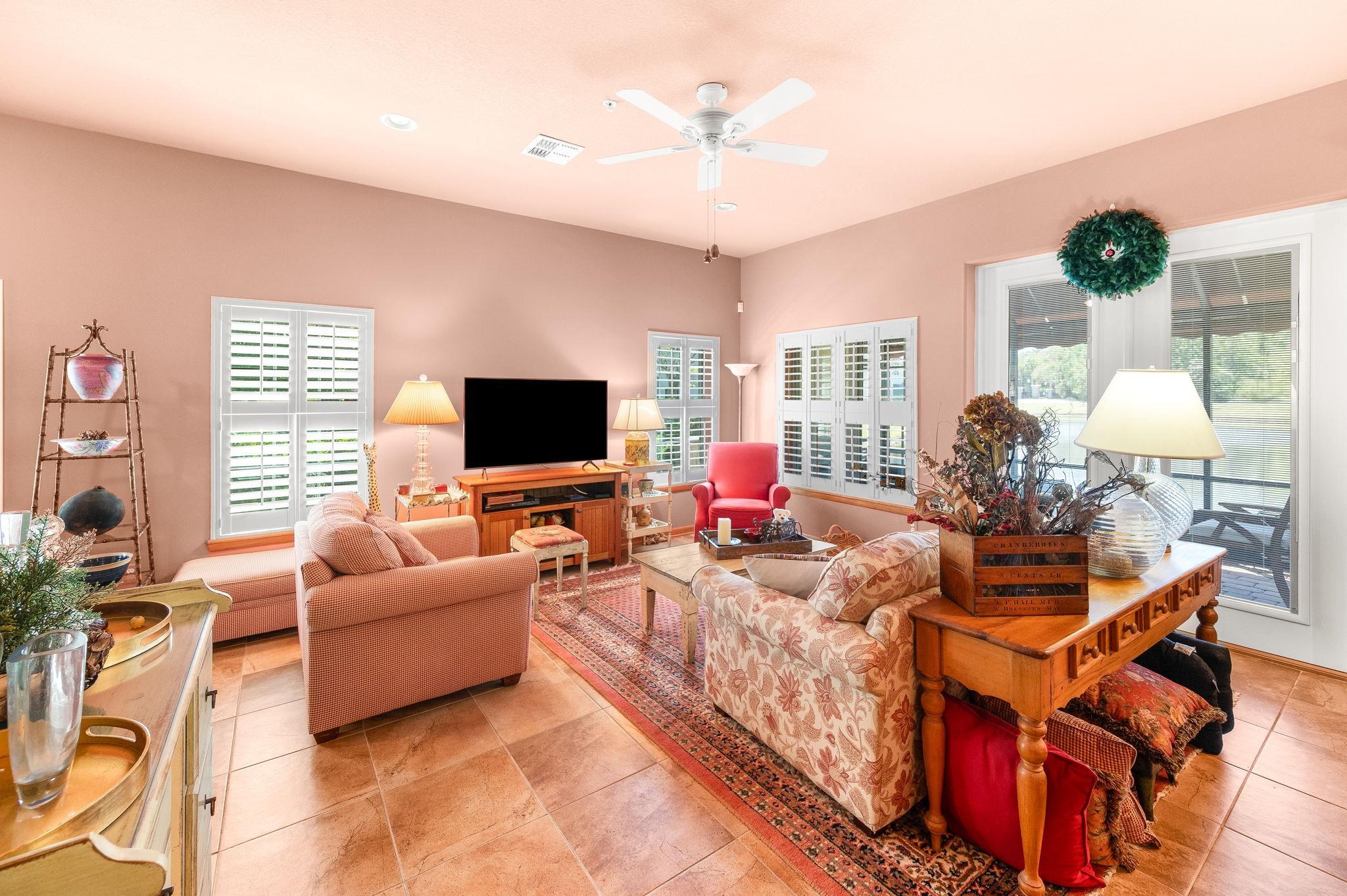 99 Grand Ravine Drive St. Augustine, FL 32086 - Photo 13 of 42 a living room with furniture and a flat screen tv