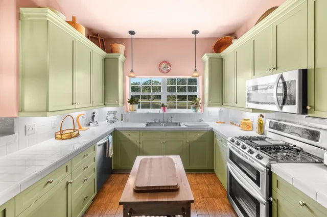 a kitchen with a stove and a sink