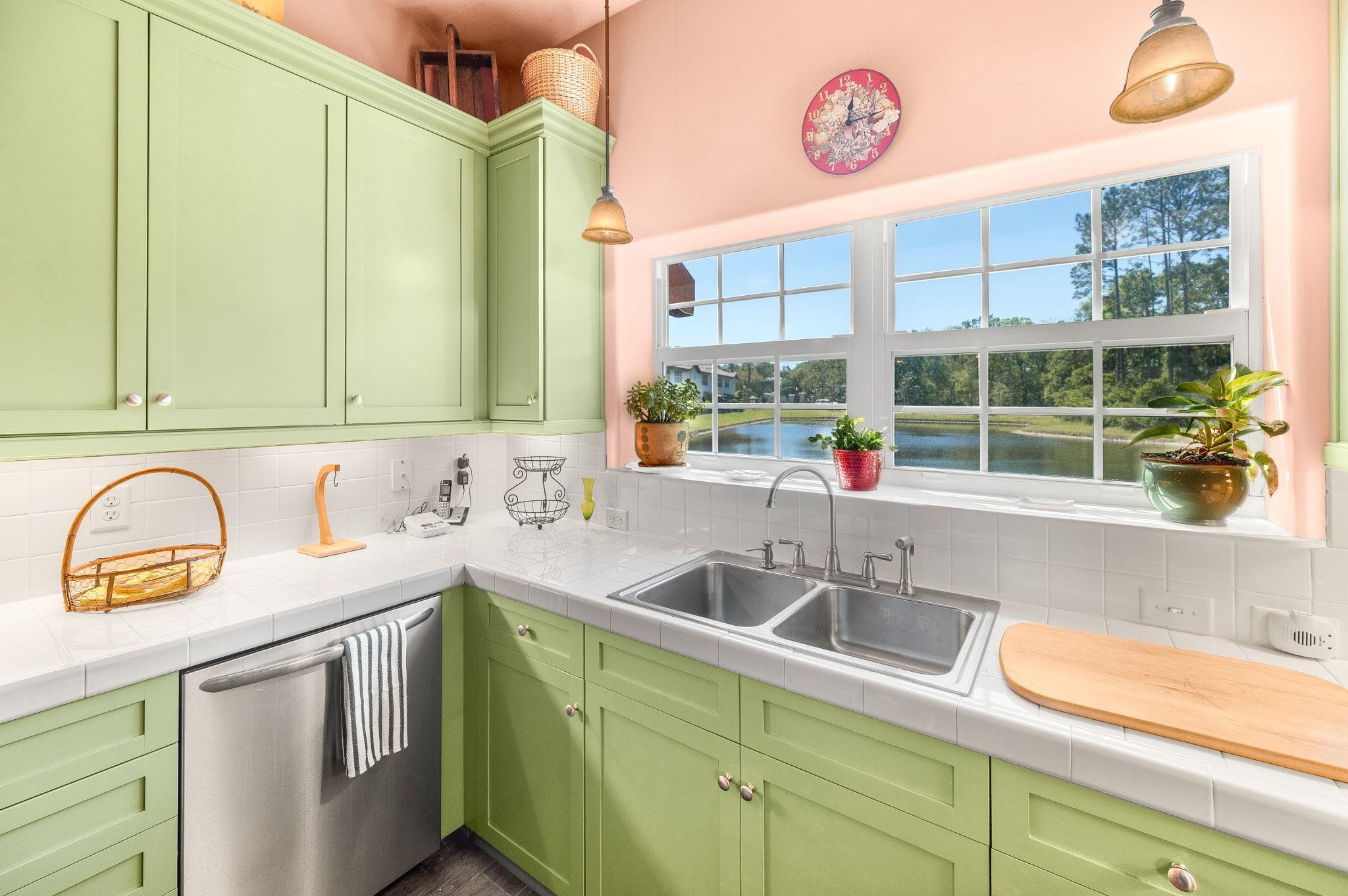 99 Grand Ravine Drive St. Augustine, FL 32086 - Photo 20 of 42 a kitchen with stainless steel appliances granite countertop a sink and a window