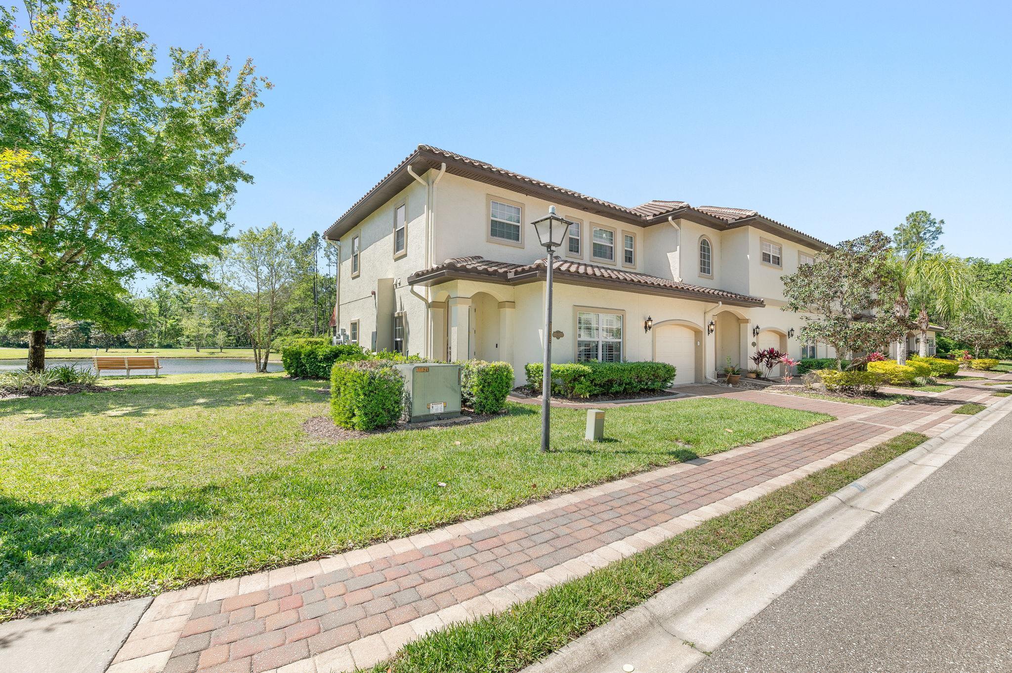 99 Grand Ravine Drive St. Augustine, FL 32086 - Photo 2 of 42 a front view of house with yard and green space