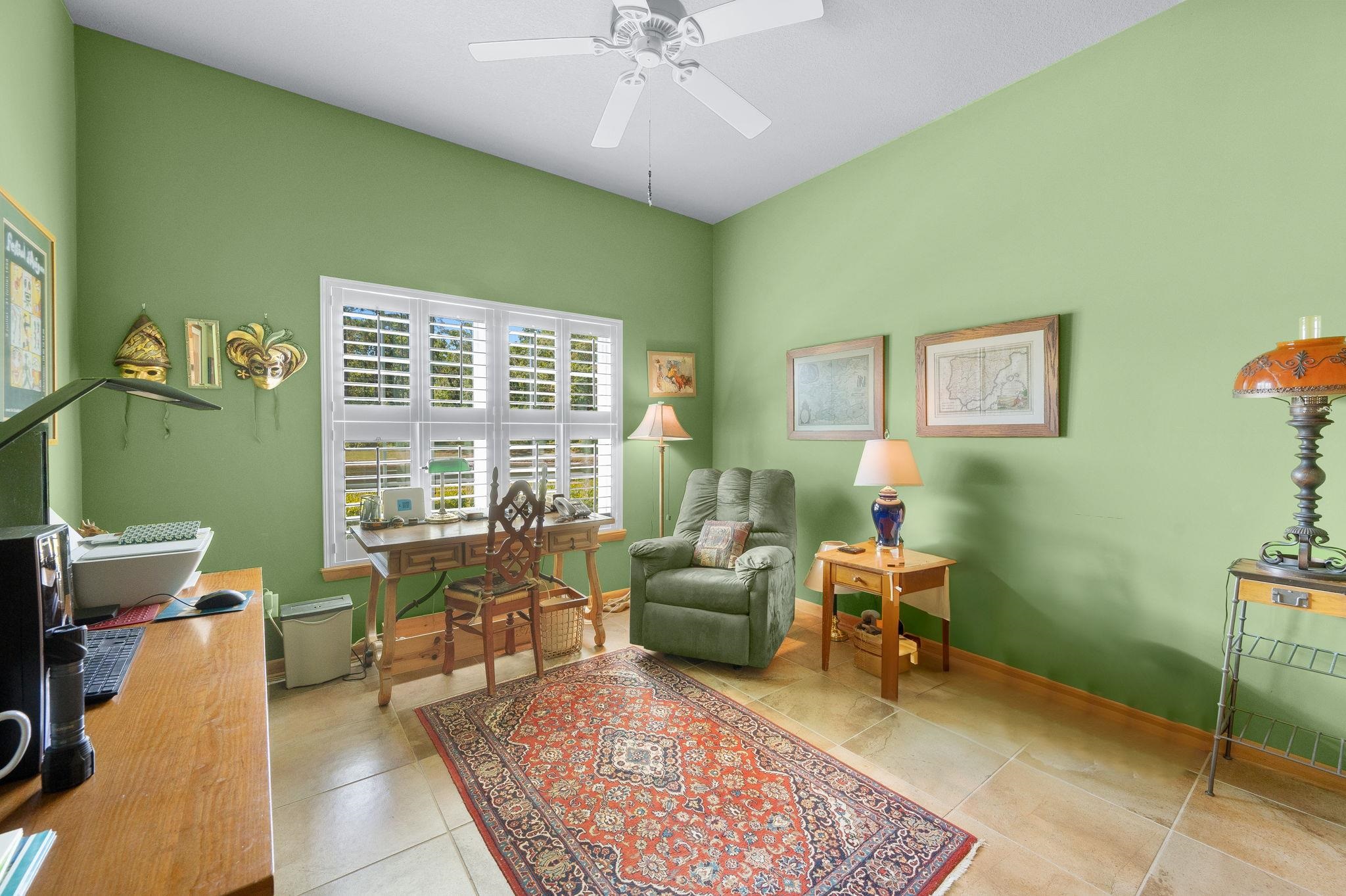 99 Grand Ravine Drive St. Augustine, FL 32086 - Photo 24 of 42 a living room with furniture and a large window