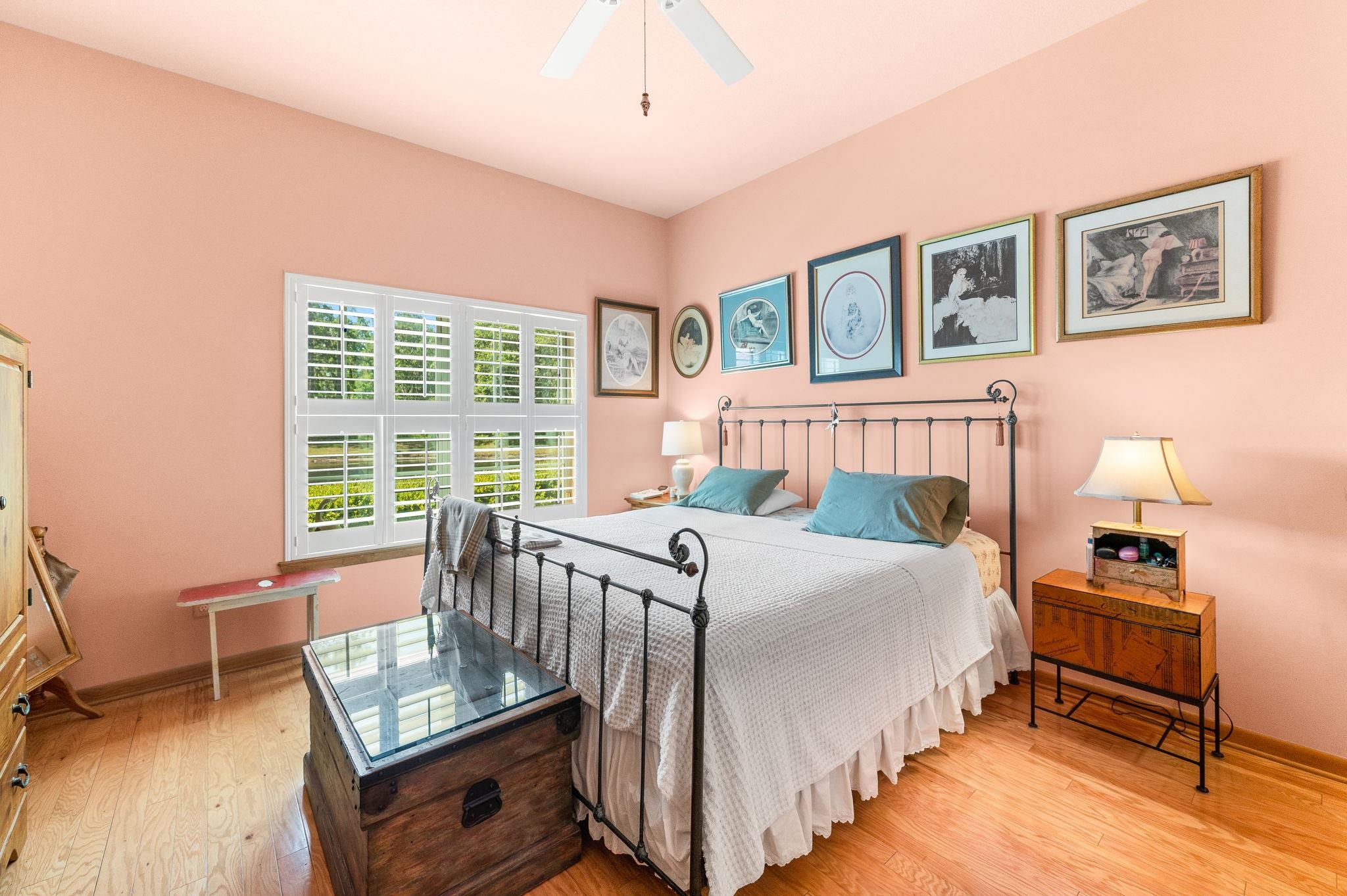 99 Grand Ravine Drive St. Augustine, FL 32086 - Photo 27 of 42 a bedroom with a bed and a table in it