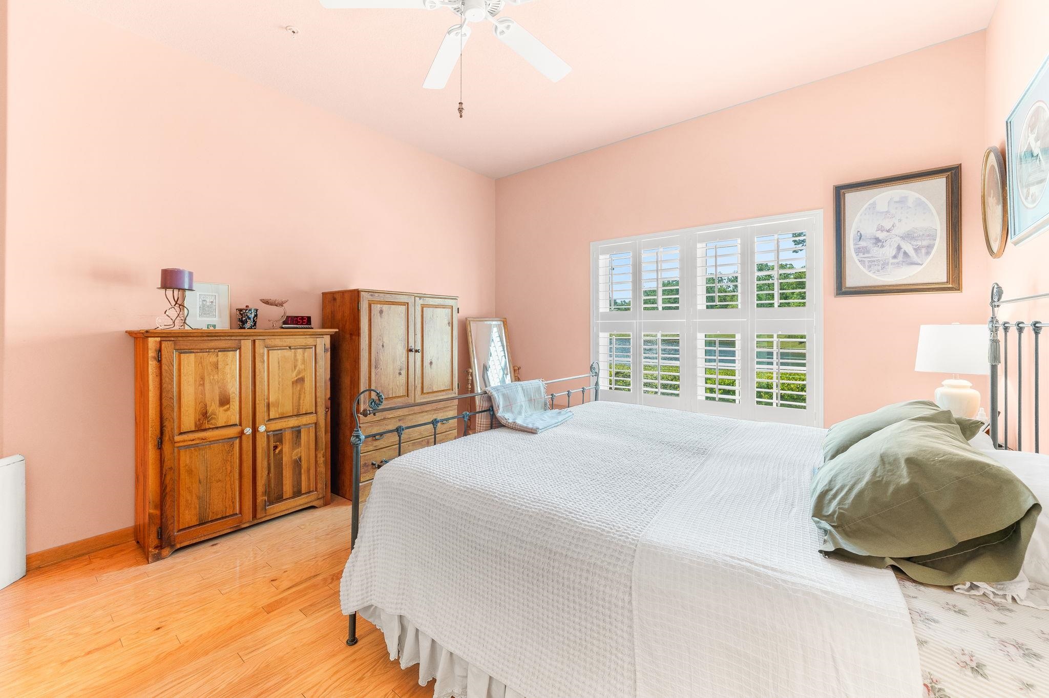 99 Grand Ravine Drive St. Augustine, FL 32086 - Photo 29 of 42 a bedroom with a bed and a cabinets