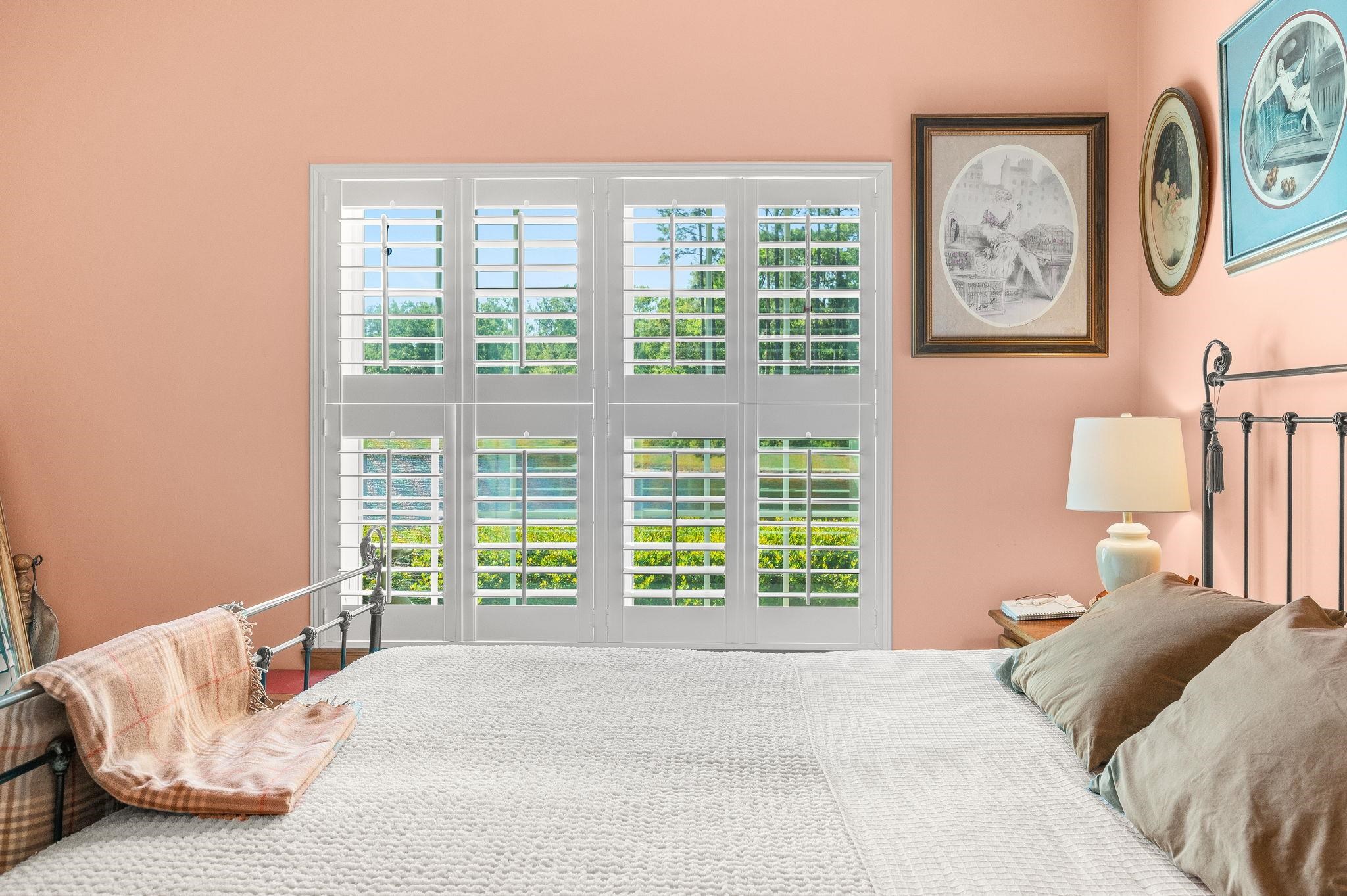 99 Grand Ravine Drive St. Augustine, FL 32086 - Photo 30 of 42 a bedroom with a bed and a large window