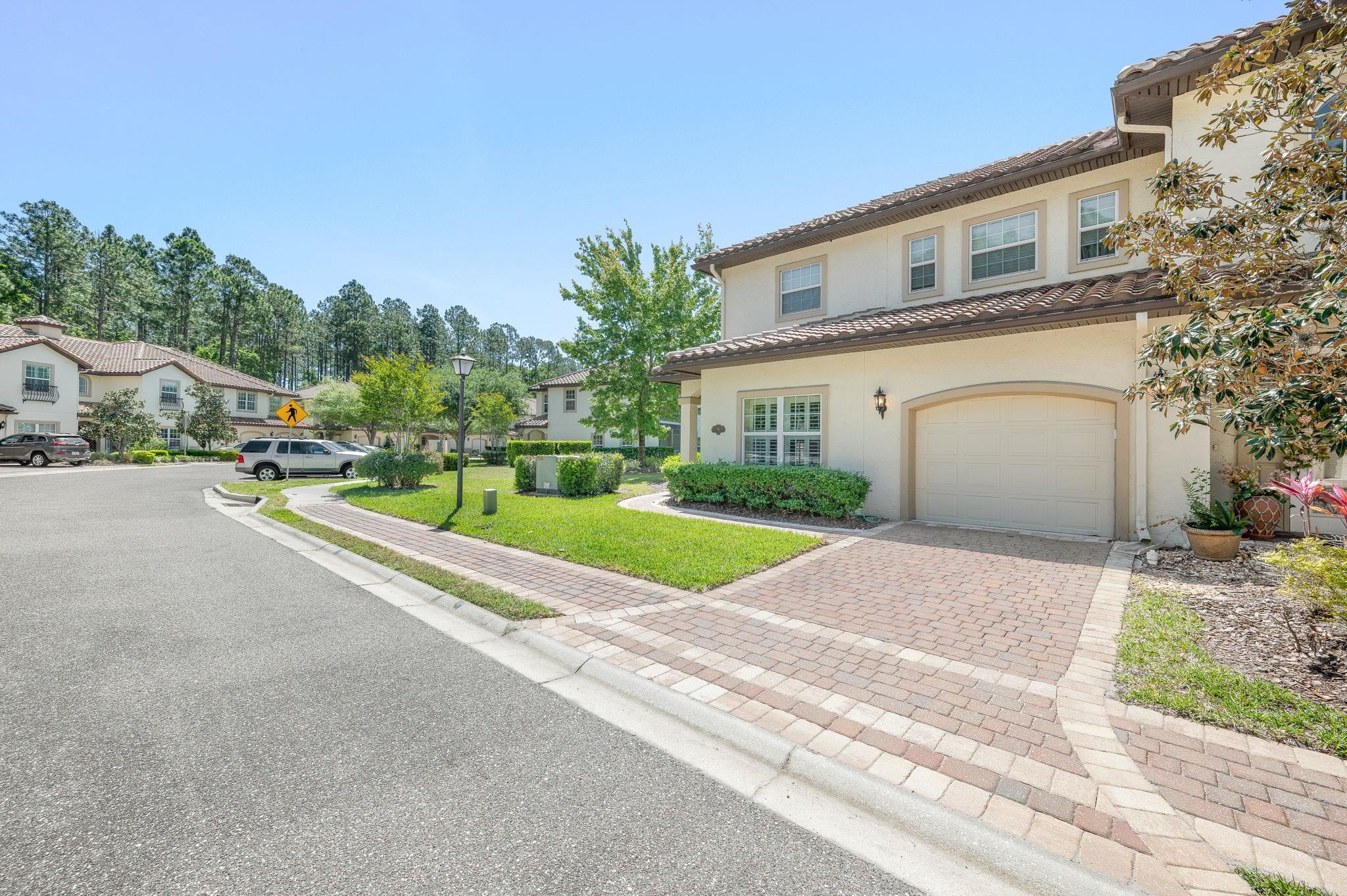 99 Grand Ravine Drive St. Augustine, FL 32086 - Photo 3 of 42 a view of street along with residential houses
