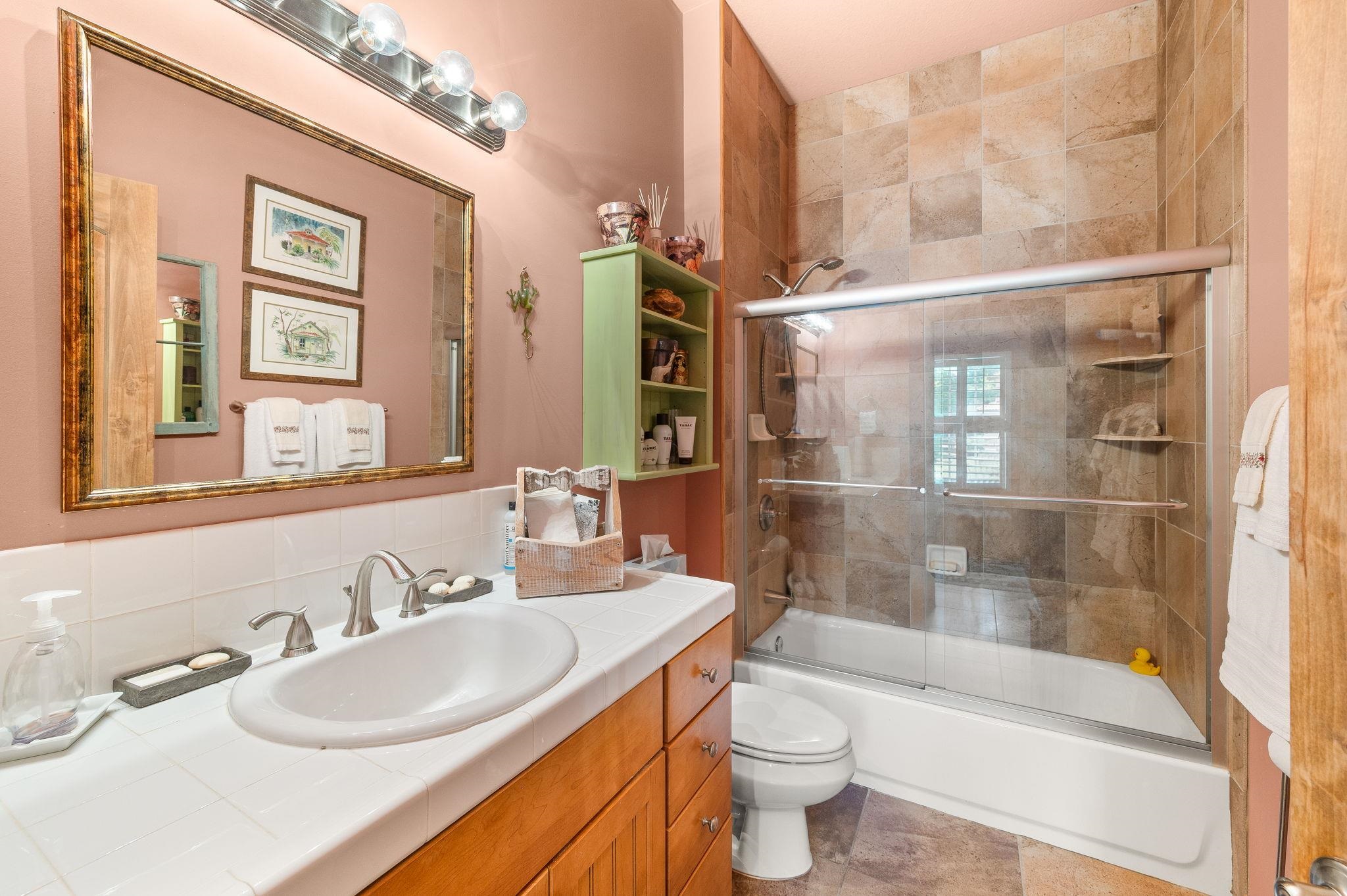 99 Grand Ravine Drive St. Augustine, FL 32086 - Photo 37 of 42 a bathroom with a sink and a mirror