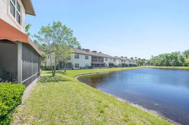 a view of a swimming pool with a yard