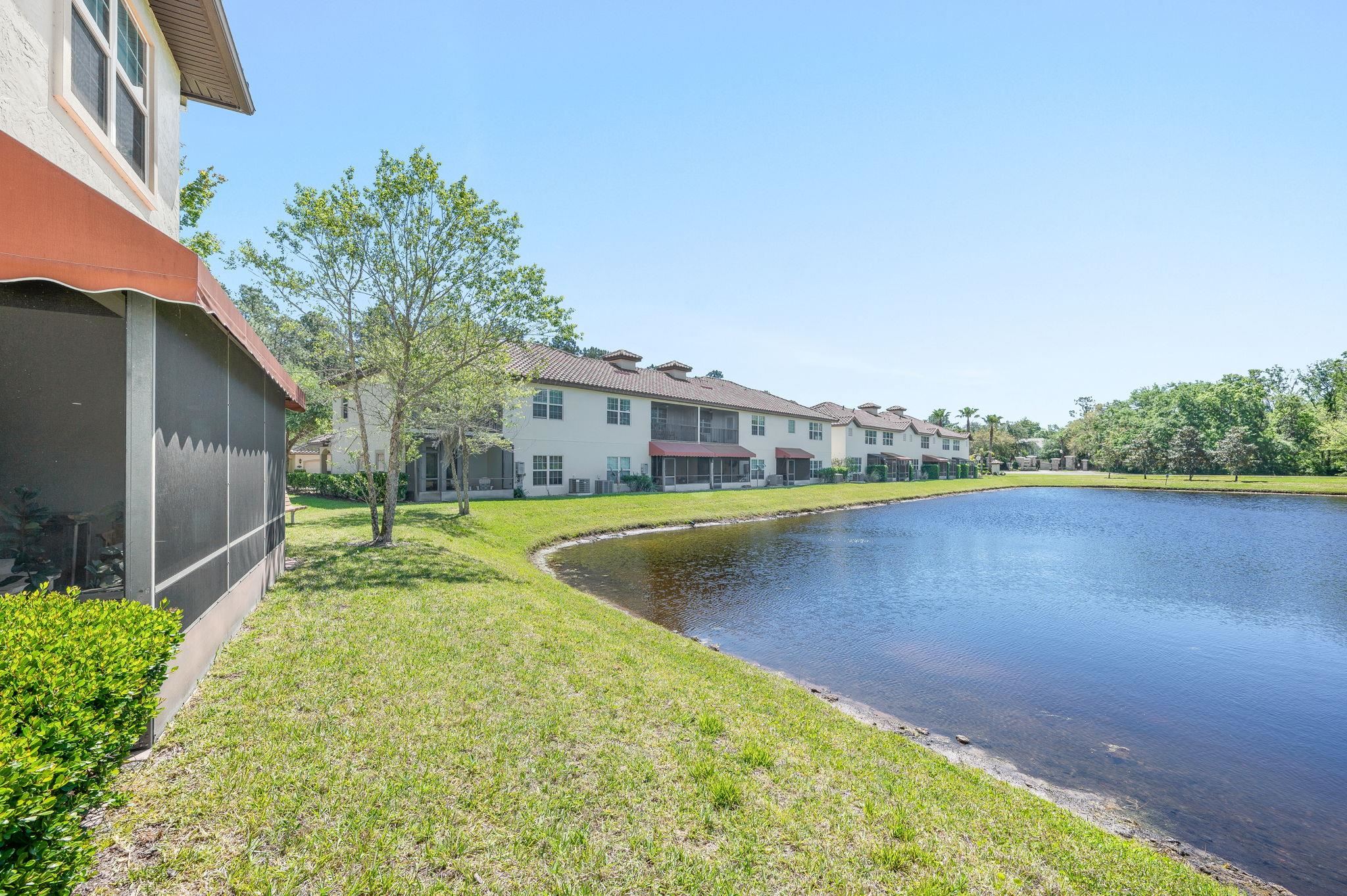 99 Grand Ravine Drive St. Augustine, FL 32086 - Photo 4 of 42 a view of a swimming pool with a yard