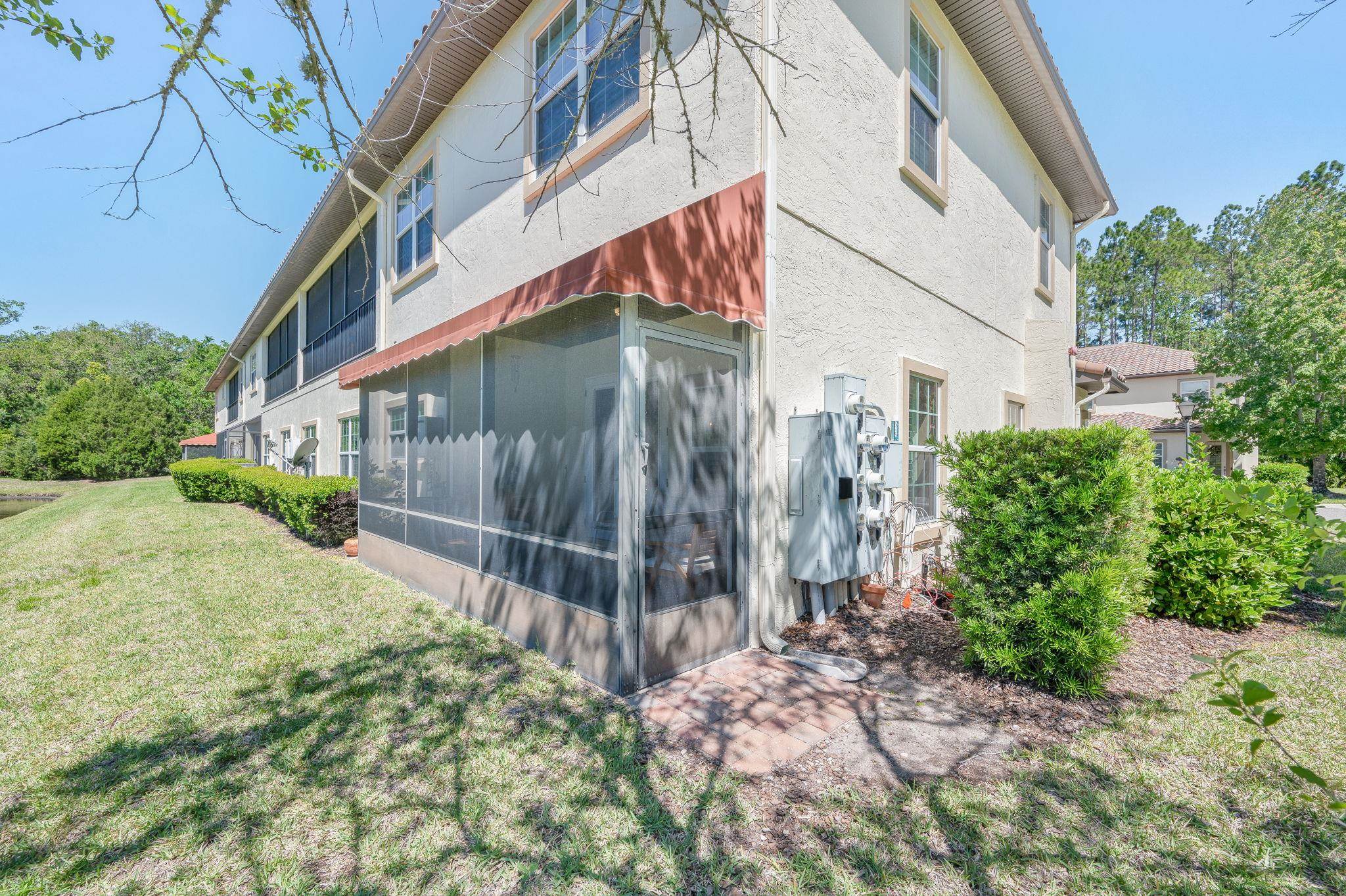 99 Grand Ravine Drive St. Augustine, FL 32086 - Photo 42 of 42 a backyard of a house with lots of green space