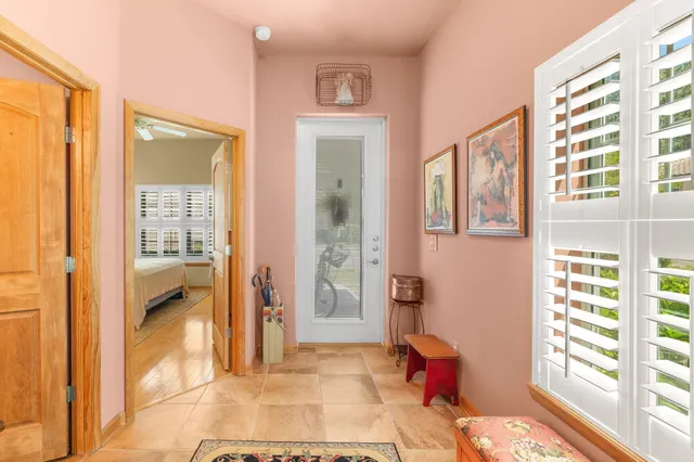 a bedroom with furniture and a window