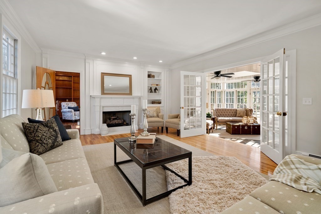105 Plain Road Wayland, MA 01778 - Photo 11 of 25 a living room with furniture window and a fireplace