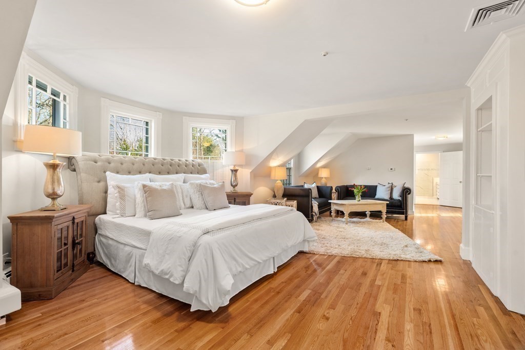 105 Plain Road Wayland, MA 01778 - Photo 17 of 25 a spacious bedroom with a bed and wooden floor