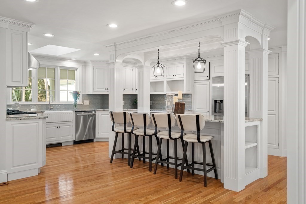 105 Plain Road Wayland, MA 01778 - Photo 2 of 25 a large kitchen with a table and chairs