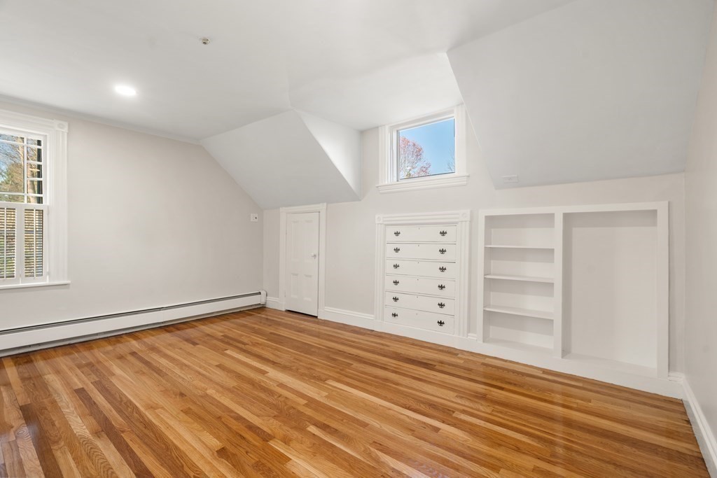 105 Plain Road Wayland, MA 01778 - Photo 21 of 25 wooden floor in an empty room with window and wooden floor
