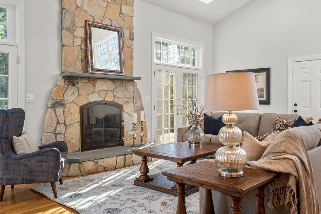 105 Plain Road Wayland, MA 01778 - Photo 5 of 25 a living room with furniture a fireplace and a table