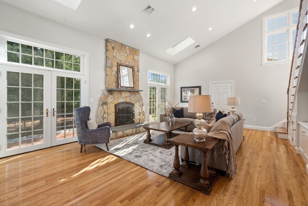 105 Plain Road Wayland, MA 01778 - Photo 6 of 25 a living room with furniture and a fireplace