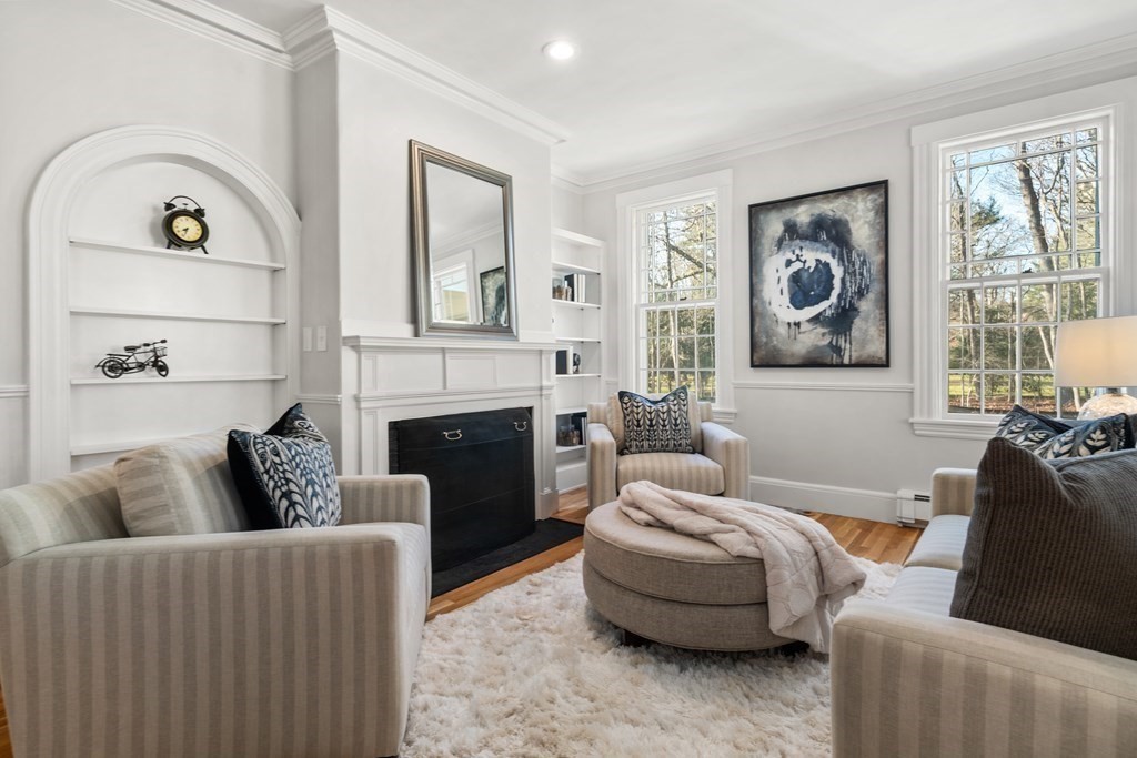 105 Plain Road Wayland, MA 01778 - Photo 8 of 25 a living room with furniture and a fireplace