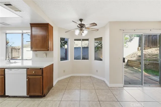 a bathroom with a granite countertop sink a mirror and a vanity