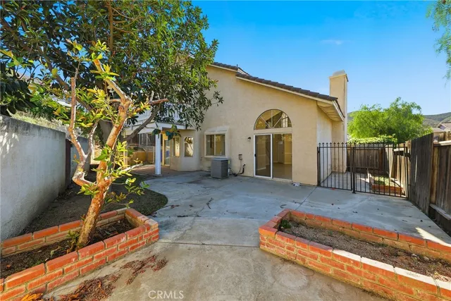 a view of balcony with wooden floor and a potted plant