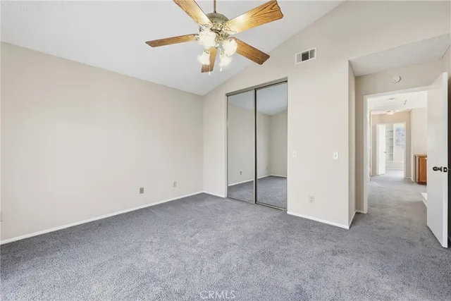 a balcony with wooden floor and fence