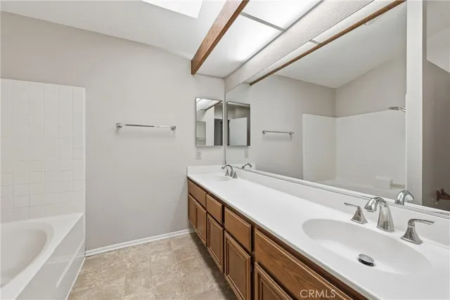 an empty room with a chandelier fan