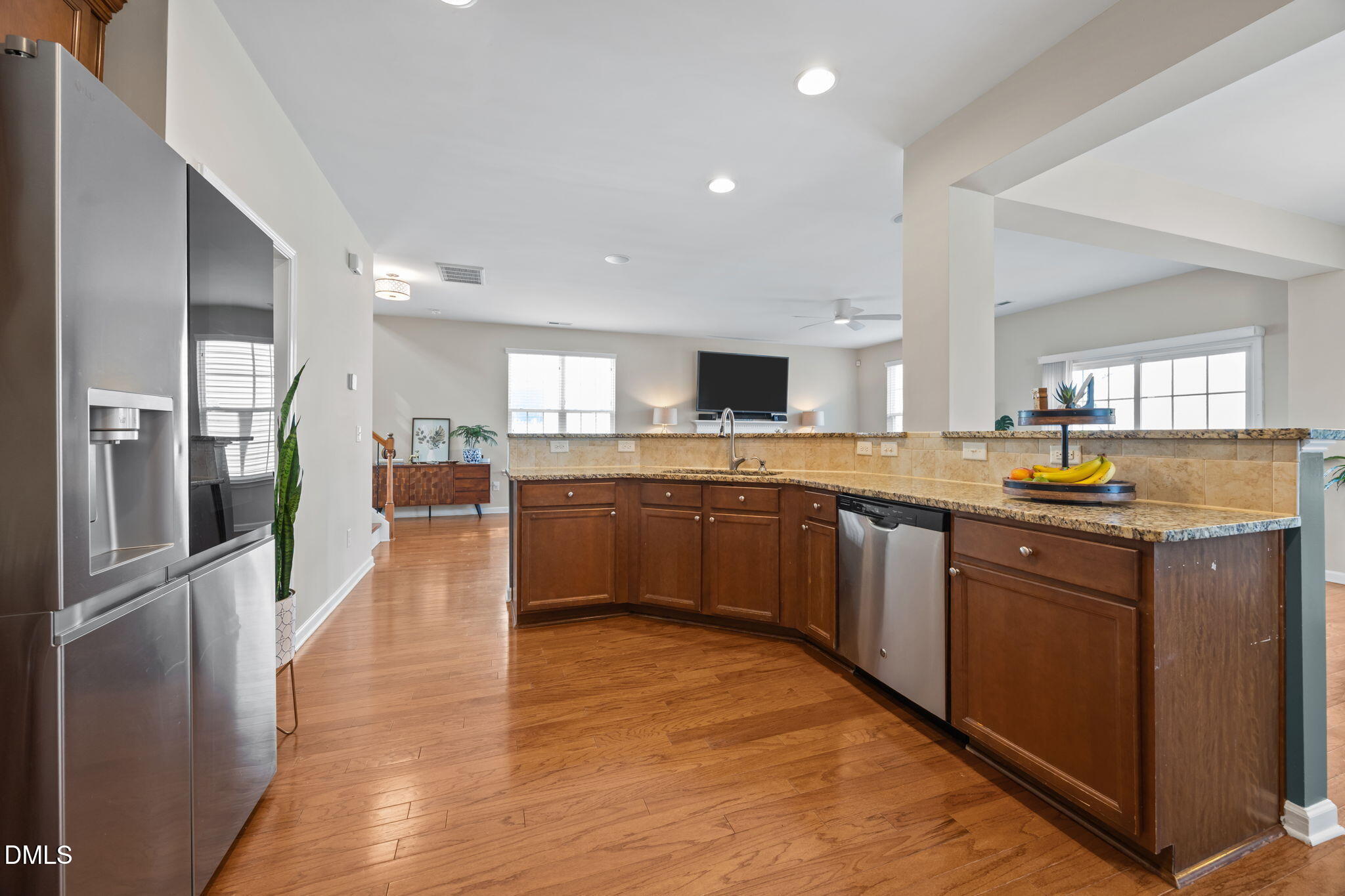 5049 Jelynn Street Raleigh, NC 27616 - Photo 11 of 33 a large kitchen with stainless steel appliances and a refrigerator