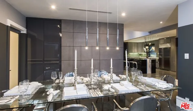 a kitchen with kitchen island granite countertop a sink and cabinets