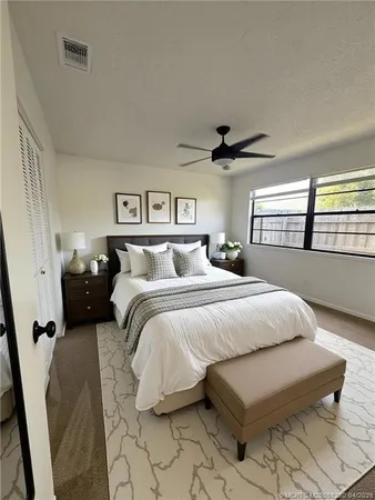 a bedroom with bed and window