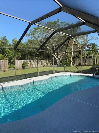a view of a yard with a swimming pool