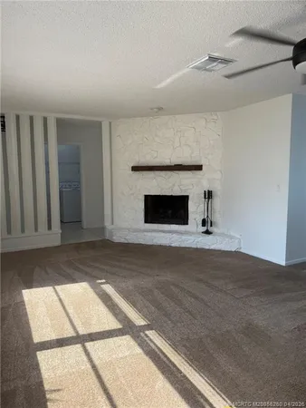 a living room with a fireplace furniture and a window