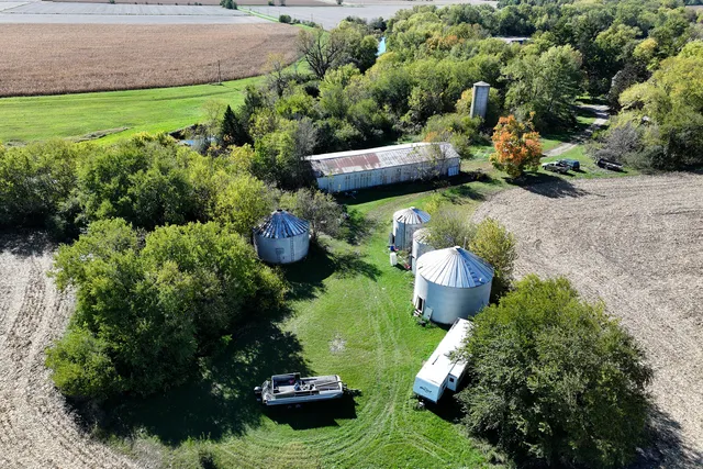 a view of a table and chairs in a garden