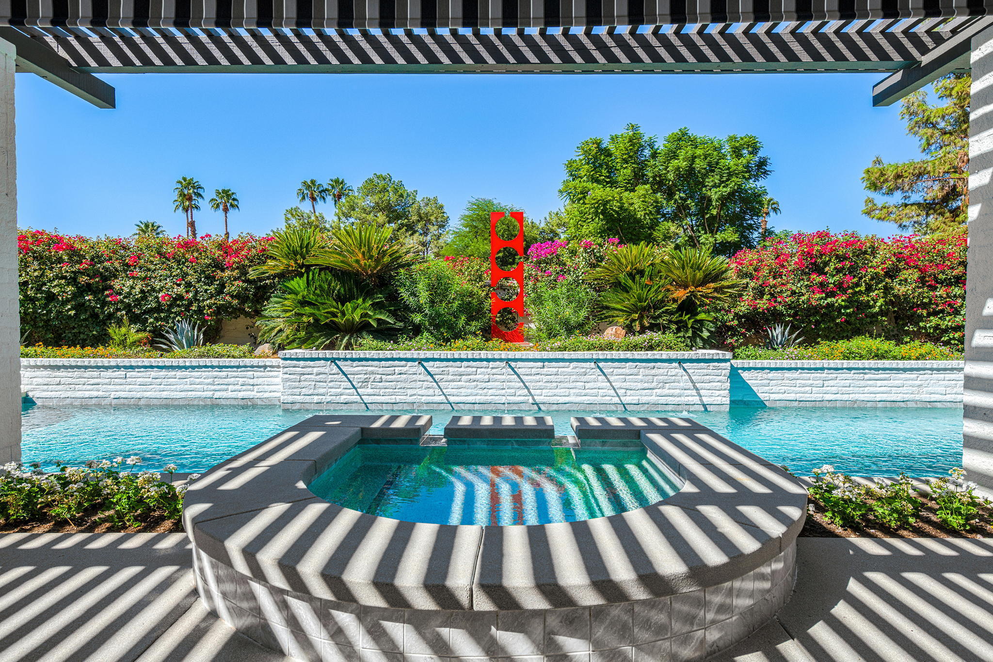 30 Mayfair Drive Rancho Mirage, CA 92270 - Photo 23 of 30 a view of a swimming pool with a patio