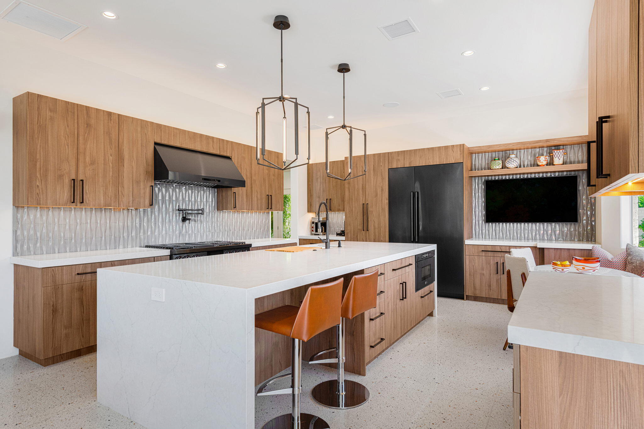 30 Mayfair Drive Rancho Mirage, CA 92270 - Photo 7 of 30 a kitchen with stainless steel appliances a stove a sink island and a refrigerator with wooden floor
