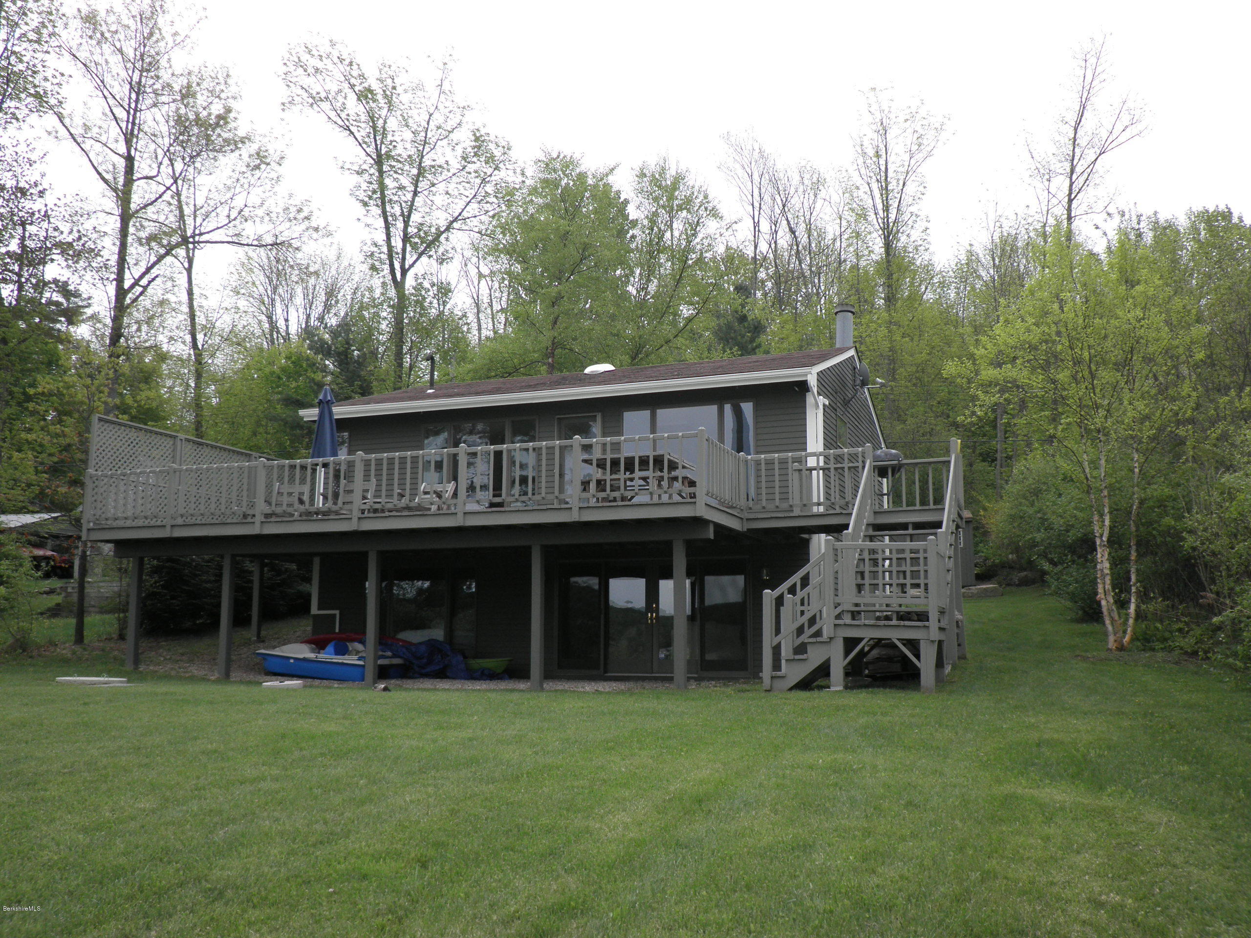 63 A Goose Pond Road Tyringham, MA 01238 - Photo 1 of 5 a front view of a house with garden