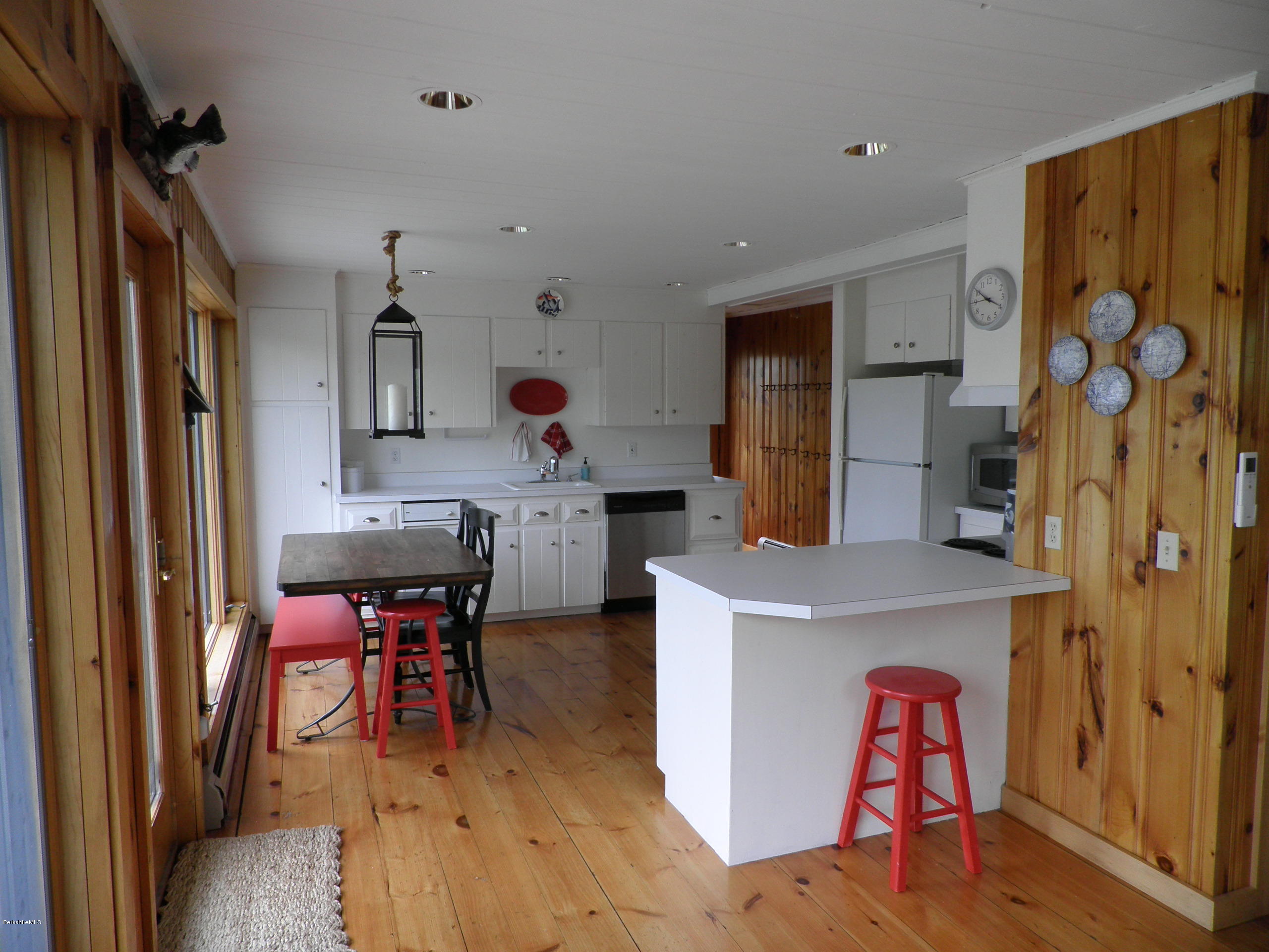 63 A Goose Pond Road Tyringham, MA 01238 - Photo 4 of 5 a view of kitchen center island dining table and wooden floor