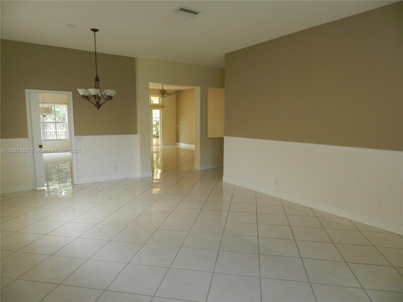 1234 Chenille Circle Weston, FL 33327 - Photo 3 of 35 a view of a livingroom and a bathroom