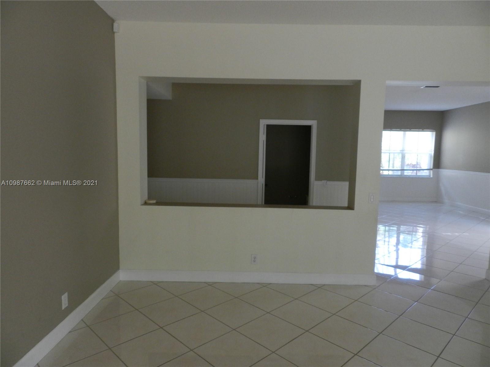 1234 Chenille Circle Weston, FL 33327 - Photo 10 of 35 a view of an empty room and window