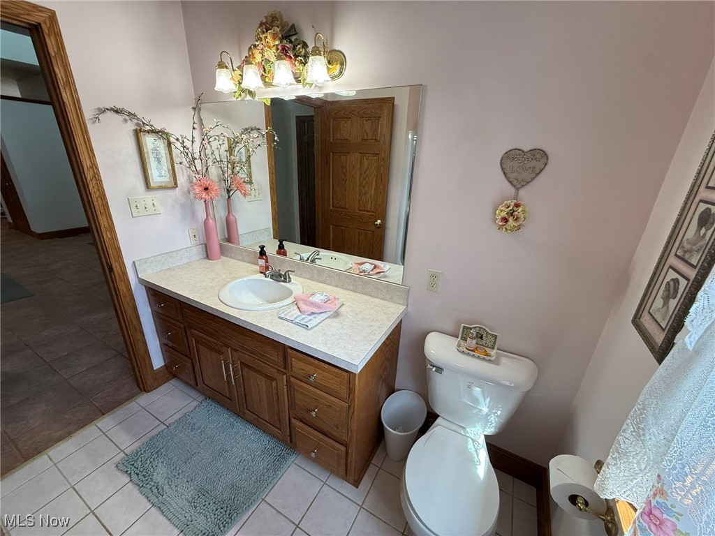 2178 Pleasant Valley Road Northeast New Philadelphia, OH 44663 - Photo 26 of 50 Bathroom featuring light tile patterned flooring and vanity