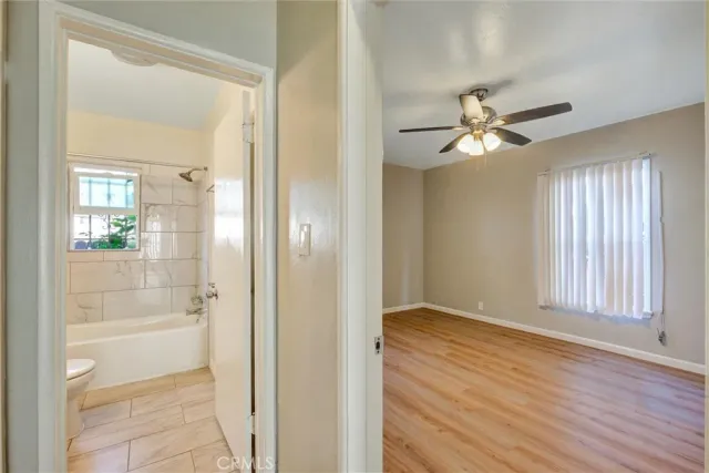 wooden floor in an empty room with a mirror