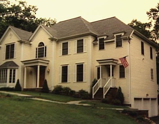 14 Blacksmith Ridge Ridgefield, CT 06877 - Photo 1 of 1 a front view of a house with a yard